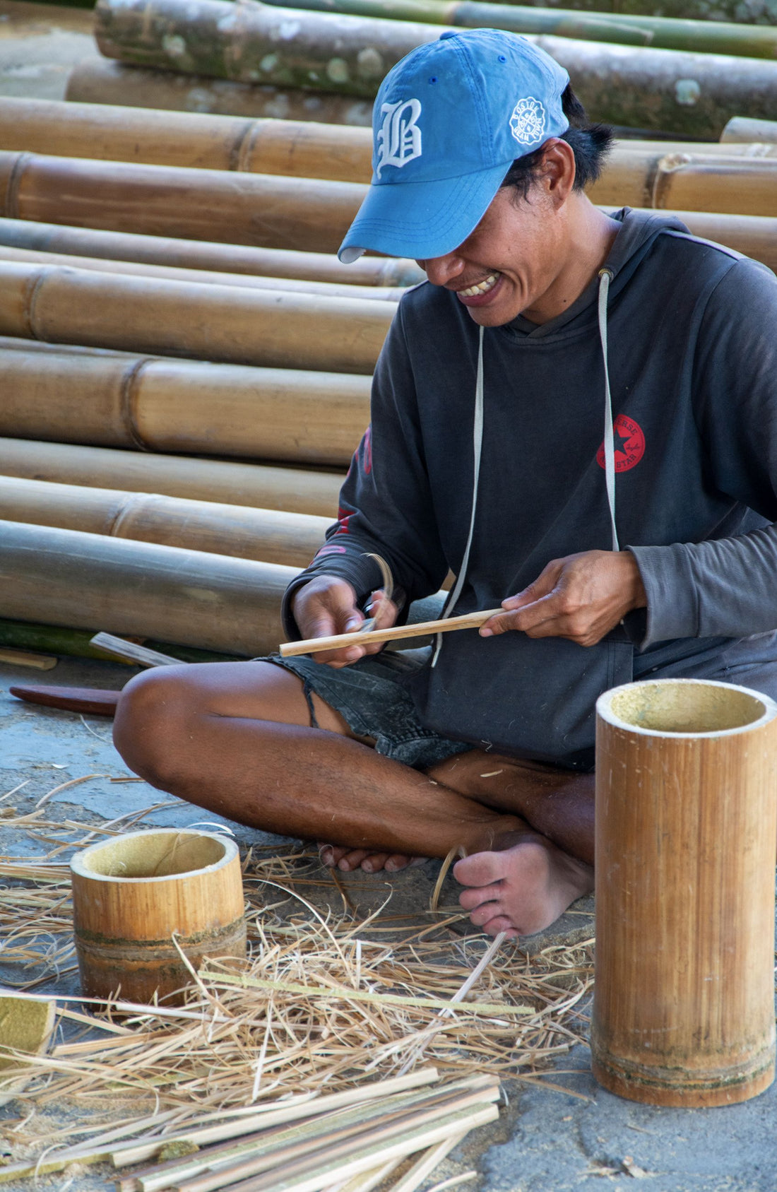 Artisan hand-cutting and shaping bamboo using traditional techniques, the first steps in crafting a Puff Panda bamboo water pipe